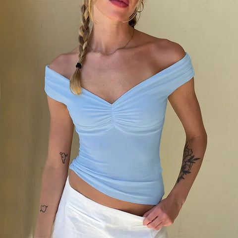 Model wearing the solid color camisole with jeans