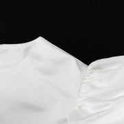 Close-up of the satin fabric’s smooth texture